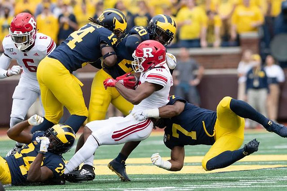 Lavert Hill (24), Josh Metellus (14), Brad Hawkins (20), and Khaleke Hudson (7)