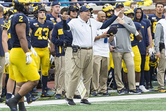 Carlo Kemp (2), Jim Harbaugh, and Don Brown