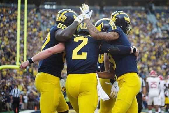 Nick Eubanks (82), Shea Patterson (2), and Ronnie Bell (8)