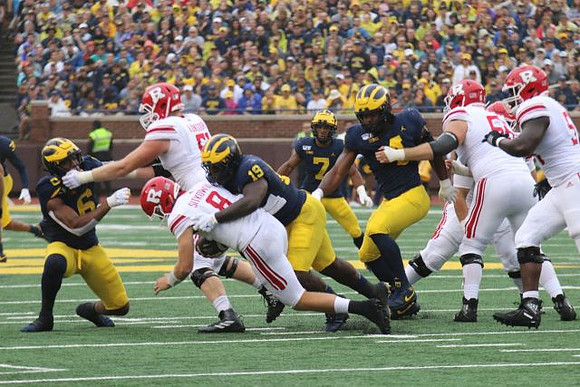 Josh Uche (6), Kwity Paye (19), Khaleke Hudson (7), and Michael Danna (4)