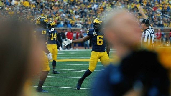 Kwity Paye (19), Josh Metellus (14), and Josh Uche (6)