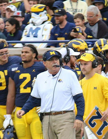 Aidan Hutchinson (97), Carlo Kemp (2), and Don Brown