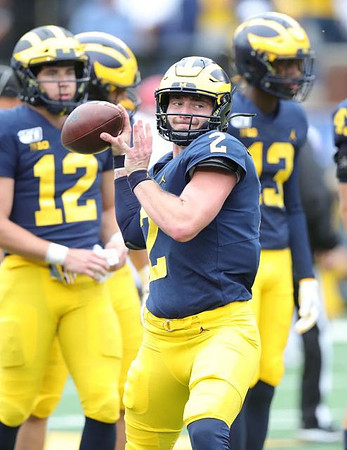 Cade McNamara (12), Shea Patterson (2), and Tru Wilson (13)