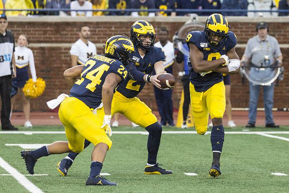 Zach Charbonnet (24), Shea Patterson (2), and Donovan Peoples-Jones (9)