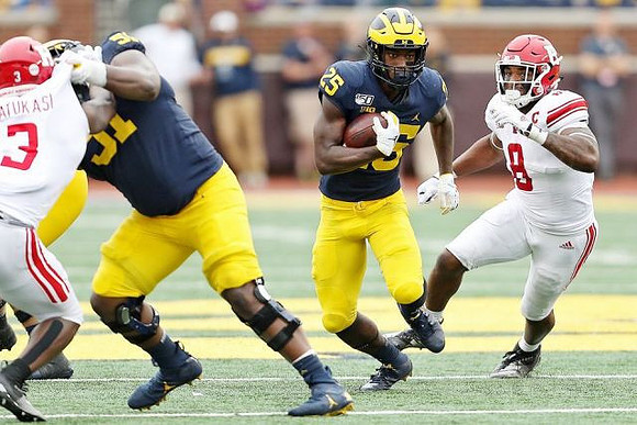 Cesar Ruiz (51) and Hassan Haskins (25)