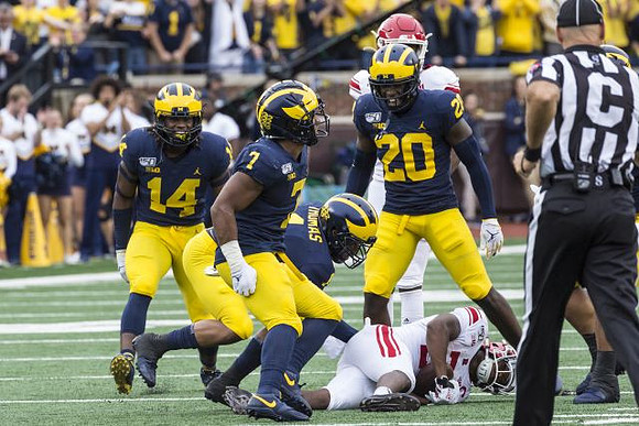 Josh Metellus (14), Khaleke Hudson (7), Ambry Thomas (1), and Brad Hawkins (20)