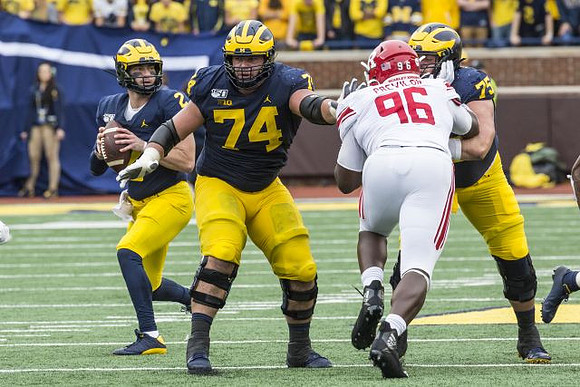 Shea Patterson (2), Ben Bredeson (74), and Jon Runyan Jr. (75)