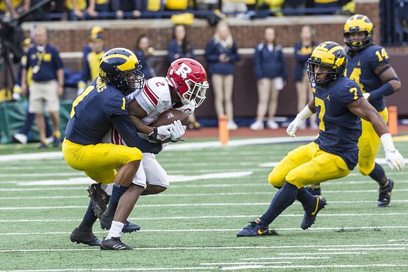 Ambry Thomas (1), Khaleke Hudson (7), and Josh Metellus (14)
