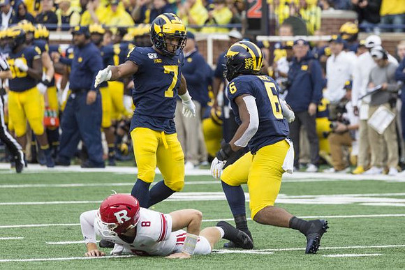 Khaleke Hudson (7) and Josh Uche (6)