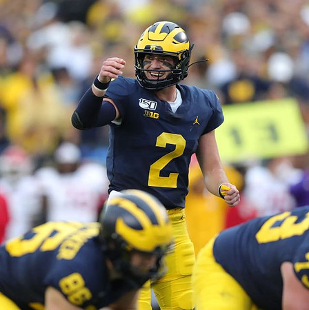 Luke Schoonmaker (86), Jalen Mayfield (73), and Shea Patterson (2)
