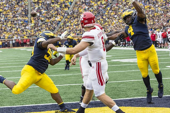 Michael Dwumfour (50), Khaleke Hudson (7), and Michael Danna (4)