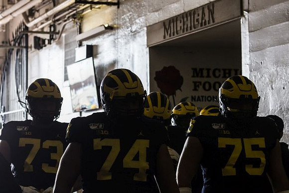 Jalen Mayfield (73), Ben Bredeson (74), and Jon Runyan Jr. (75)