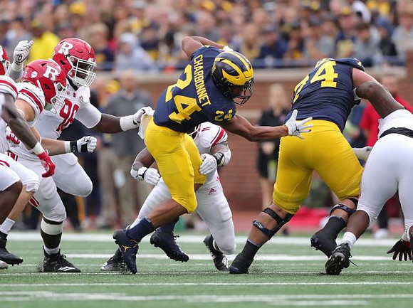 Zach Charbonnet (24) and Ben Bredeson (74)