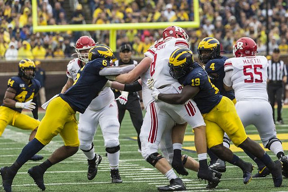Cameron McGrone (44), Josh Uche (6), Kwity Paye (19), and Michael Danna (4)
