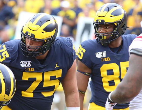 Jon Runyan Jr. (75) and Mustapha Muhammad (85)