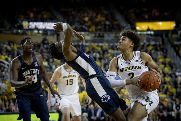 Jon Teske (15) and Jordan Poole (2)