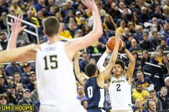 Jon Teske (15) and Jordan Poole (2)