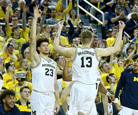 Isaiah Livers (4), Brandon Johns Jr. (23), Ignas Brazdeikis (13), and Eli Brooks (55)