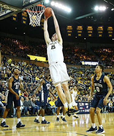 Jon Teske (15) and Jordan Poole (2)