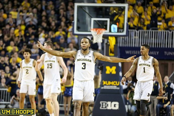 Jordan Poole (2), Jon Teske (15), Zavier Simpson (3), and Charles Matthews (1)