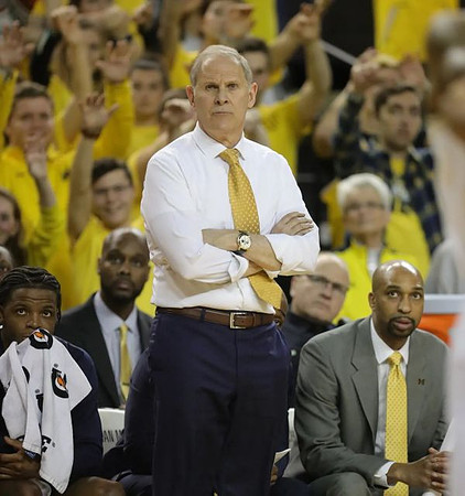 Zavier Simpson (3), John Beilein, and Saddi Washington