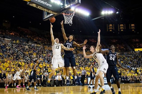 Ignas Brazdeikis (13), Eli Brooks (55), and Jon Teske (15)