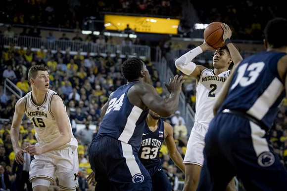 Jon Teske (15) and Jordan Poole (2)