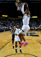 Eli Brooks (55) and Zavier Simpson (3)