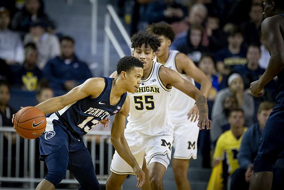Eli Brooks (55) and Jordan Poole (2)