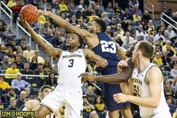 Zavier Simpson (3) and Austin Davis (51)