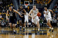 Ignas Brazdeikis (13), Jordan Poole (2), and Jon Teske (15)