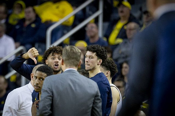 John Beilein, Charles Matthews (1), Isaiah Livers (4), Luke Yaklich, and Brandon Johns Jr. (23)