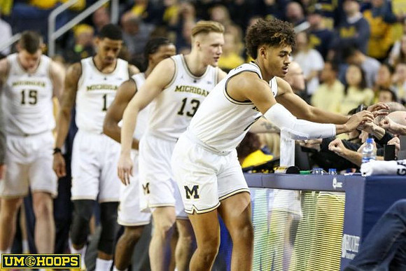 Jon Teske (15), Charles Matthews (1), Zavier Simpson (3), Ignas Brazdeikis (13), and Jordan Poole (2)