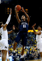 Jordan Poole (2) and Eli Brooks (55)