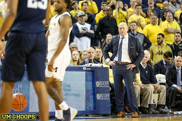 Zavier Simpson (3) and Penn State Head Coach Patrick Chambers