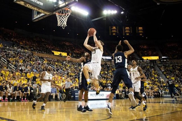Ignas Brazdeikis (13), Zavier Simpson (3), and Charles Matthews (1)