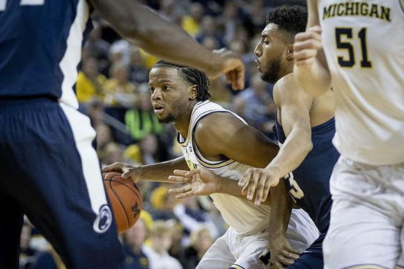 Zavier Simpson (3) and Austin Davis (51)