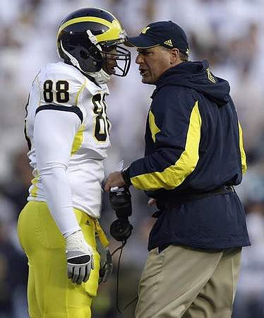 Andre Criswell (88) and Rich Rodriguez