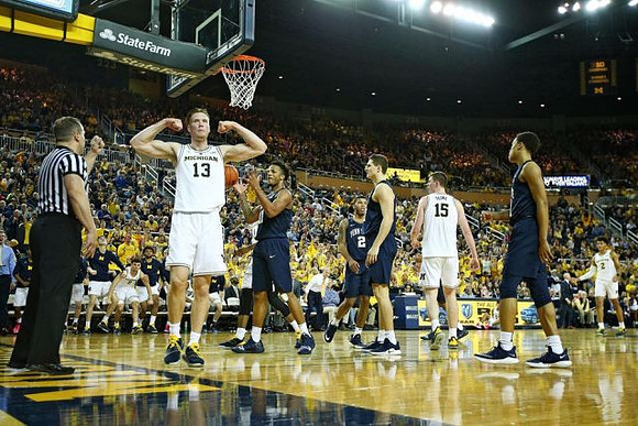 Ignas Brazdeikis (13), Jon Teske (15), and Jordan Poole (2)