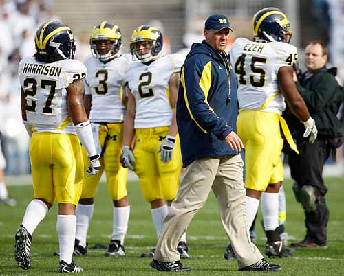 Brandon Harrison (27), Stevie Brown (3), Sam McGuffie (2), Rich Rodriguez, and Obi Ezeh (45)