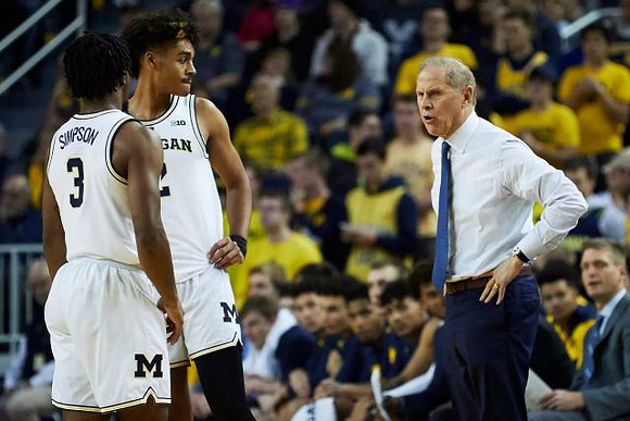 Zavier Simpson (3), Jordan Poole (2), and John Beilein