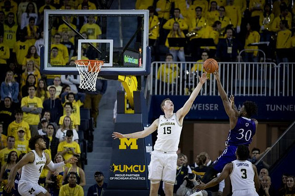 Isaiah Livers (4), Jon Teske (15), and Zavier Simpson (3)
