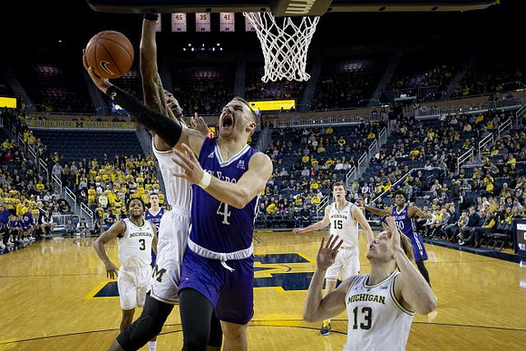Zavier Simpson (3), Jon Teske (15), and Ignas Brazdeikis (13)