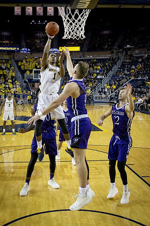 Charles Matthews (1) and Zavier Simpson (3)