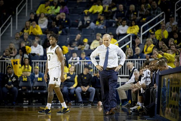 Zavier Simpson (3) and John Beilein