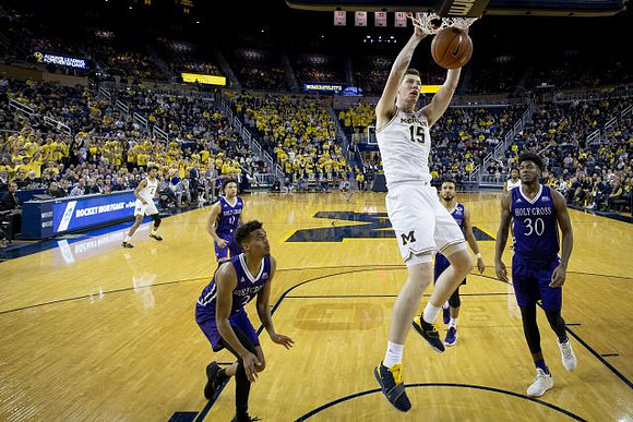 Jon Teske (15) and Jordan Poole (2)