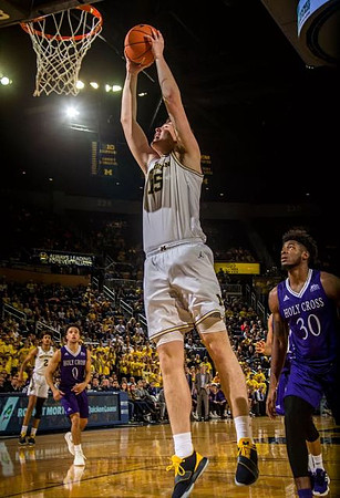 Jon Teske (15) and Jordan Poole (2)