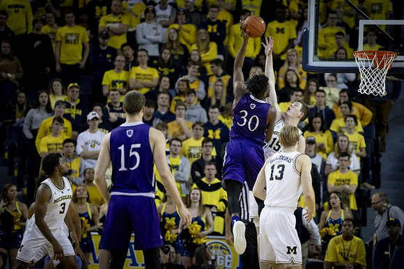 Zavier Simpson (3), Jon Teske (15), and Ignas Brazdeikis (13)