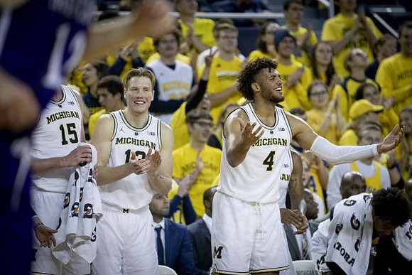 Jon Teske (15), Ignas Brazdeikis (13), Isaiah Livers (4), and Jordan Poole (2)