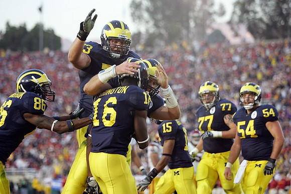 Mario Manningham, Adrian Arrington, Alex Mitchell, Chad Henne, Steve Breaston, Jake Long, and Mark Bihl